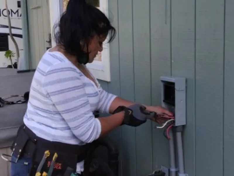 Licensed electrician wiring an exterior subpanel in Coloma